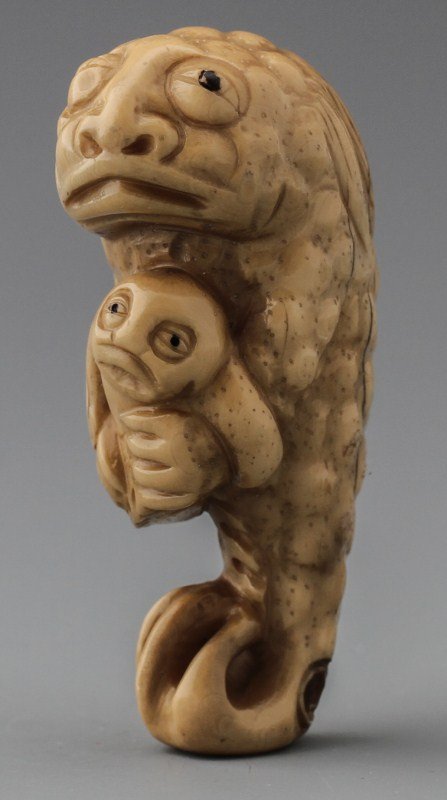 JAPANESE CARVED IVORY NETSUKE DUGONG WITH YOUNG: JAPANESE CARVED IVORY NETSUKE DUGONG WITH YOUNG Japanese carved ivory netsuke figure of dugong with young. Signed. Size: 2.5 x 1 x .75" Weight: 26.4g