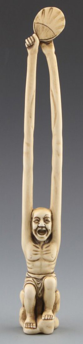 JAPANESE CARVED IVORY SASHI NETSUKE EOF ELDER: JAPANESE CARVED IVORY SASHI NETSUKE EOF ELDER Japanese carved ivory sashi netsuke of seated man holding a fan, Signed Baisho. Size: 8"l Weight: 48 g
