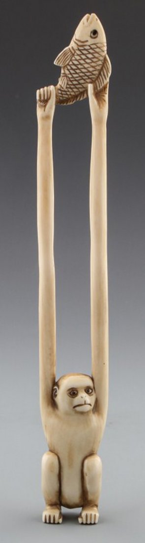 JAPANESE CARVED IVORY SASHI NETSUKE MONKEY BAISHO: JAPANESE CARVED IVORY SASHI NETSUKE MONKEY BAISHO Early 20th century Japanese carved ivory sashi netsuke of monkey, signed Baisho. Size: 7 1/4"l Weight: 31g