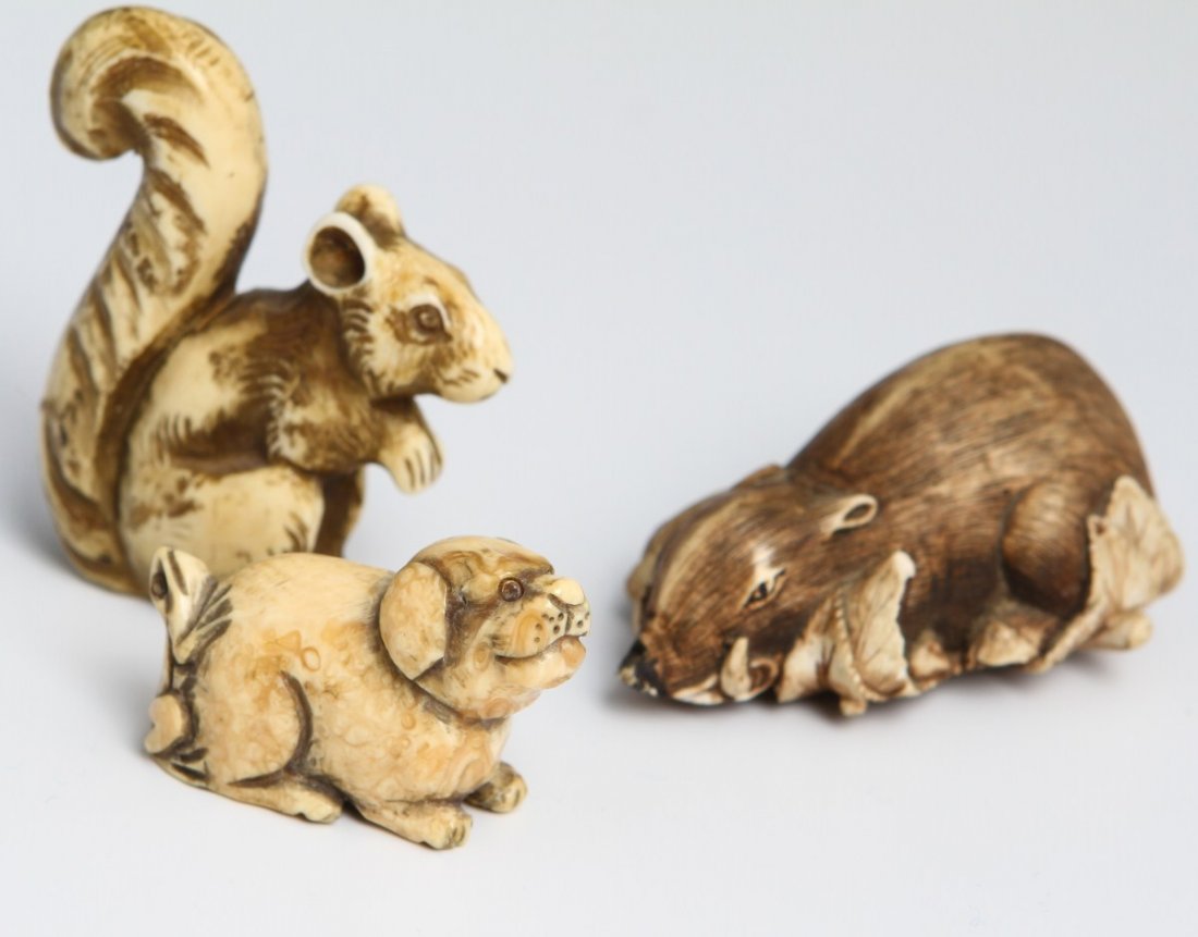ANIMAL NETSUKES AND AN OKIMONO SQUIRREL MOUSE DOG: ANIMAL NETSUKES AND AN OKIMONO SQUIRREL MOUSE DOG A lot of two carved animal netsuke figures, a squirrel and a mouse. Also included is small dog okimono figure with frog on his back. Overall good cond