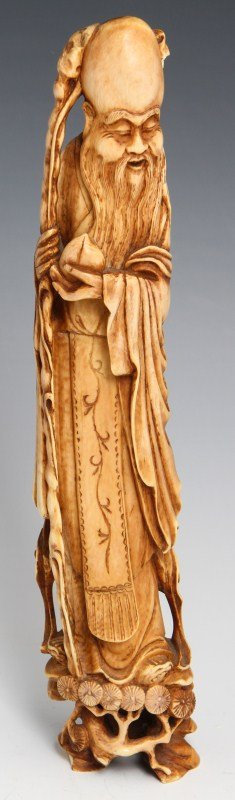 CHINESE IVORY CARVING SHOU-LAO GOD OF LONGEVITY: CHINESE IVORY CARVING SHOU-LAO GOD OF LONGEVITY A Chinese carved ivory figure of Shou-Lao, god of immortality/longevity. Standing erect with bulbous forehead and flowing beard, in his long robes; Shou