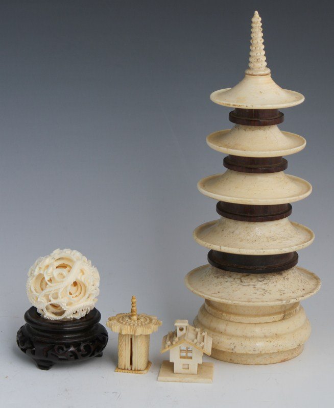 LOT OF ASIAN IVORY CARVED PAGODAS AND PUZZLE BALL: LOT OF ASIAN IVORY CARVED PAGODAS AND PUZZLE BALL Four pieces of Asian carved ivory, including a stylized five tier pagoda with ivory base, two miniature carvings of a tent and house with reflective m