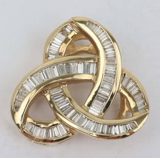 14K GOLD 3 CARAT DIAMOND LOVE KNOT SLIDE PENDANT: Ladies 14k tapered baguette diamond "Love Knot" diamond pendant slide. Set with 3 carat of diamonds. 30mm x 30mm 1.2 ". 12.9 GRAMS. Must be paid by Certified Check, money order, or wire transfer