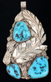 SILVER AND TURQUOISE NAVAJO PENDANT