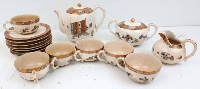 YABU MEIZAN JAPANESE TEA SERVICE: Yabu Meizan Satsuma tea service, six tea cups, seven saucers (wear to gold trim), tea pot 5", creamer and sugar (repairs to handles). Craquelure to the glaze. Local Pickup or Third Party Shipping.