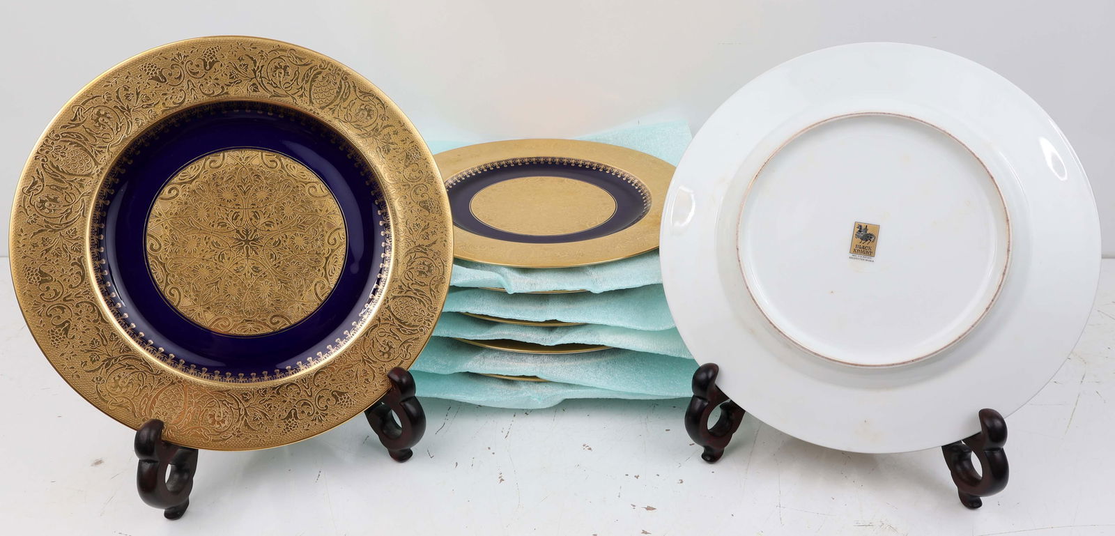 BLACK KNIGHT ENCRUSTED GOLD AND NAVY DINNER PLATES: 12 Heavily encrusted gold dinner plates with cobalt and gold center made by Black Knight. Plates are 11"Local Pickup or Third Party Shipping. Condition: Fine