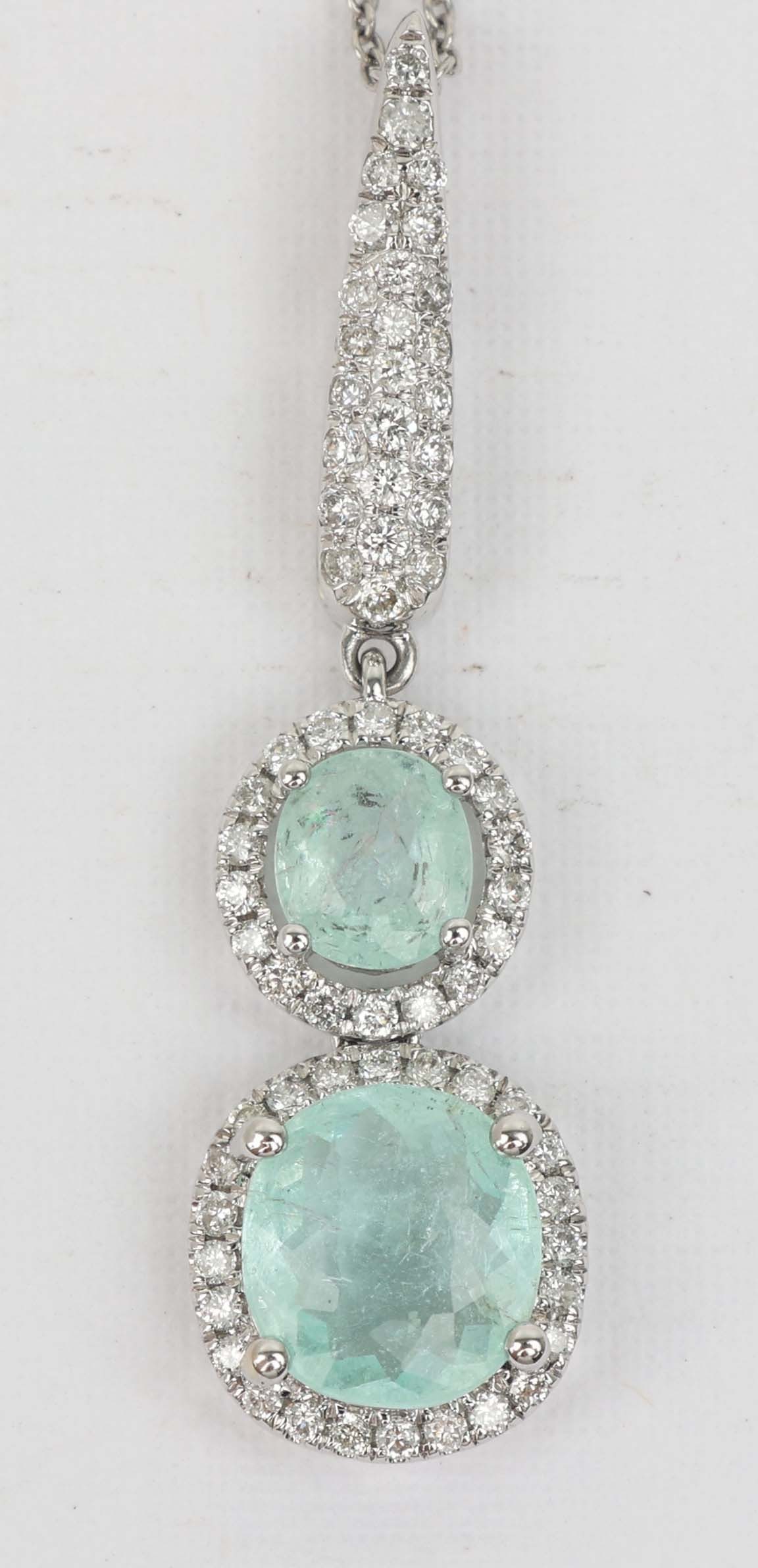 14K WHITE GOLD DIAMOND TOURMALINE PENDANT: 14k white gold Michael Christoff Diamond and Tourmaline pendant. 77 round diamonds .42ct 2 tourmaline 1.90 ct. Length: 18" Grams: 3.7 Must be paid by Certified Check, money order, or wire transfer ($1