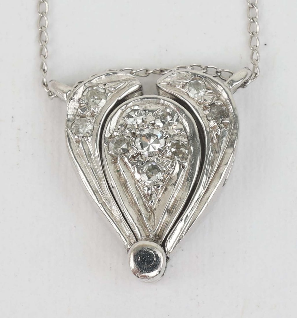 14K WHITE GOLD CONVERTIBLE DIAMOND NECKLACE: 14k Ladies Convertible Diamond Necklace. 9 accent diamonds .22 ct total. Length: 14" Grams: 2.6 Must be paid by Certified Check, money order, or wire transfer ($15 fee). NO CREDIT OR PERSONAL CHECK PA