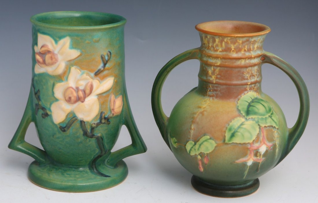 BLUE ROSEVILLE POTTERY VASES FUSCHIA & MAGNOLIA: BLUE ROSEVILLE POTTERY VASES FUSCHIA & MAGNOLIA A lot of two earthenware vases by Roseville, fuschia and magnolia blue. Size: 6"