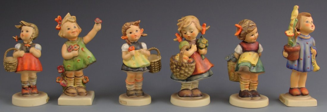 (6) GOEBEL HUMMEL GIRL FIGURES- TMK 3, 4, & 5: (6) GOEBEL HUMMEL GIRL FIGURES- TMK 3, 4, & 5 Six Goebel Hummel figures including, "Spring Cheer" (TMK 3, #72, 5"), "Sister" (TMK 4, #98/2/0, 4.5"), "Little Shopper" (TMK 3, #96, 4.5"), "Autumn Harves