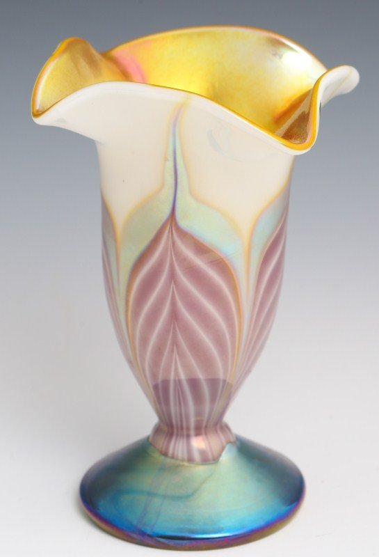 STEVEN LUNDBERG ART GLASS VASE - SIGNED: STEVEN LUNDBERG ART GLASS VASE - SIGNED A beautiful pulled feather vase with purple and silver feathering on white base glass. Gold iridescent interior. Four leaf ruffled rim. Signed : S LUNDBERG GLAS