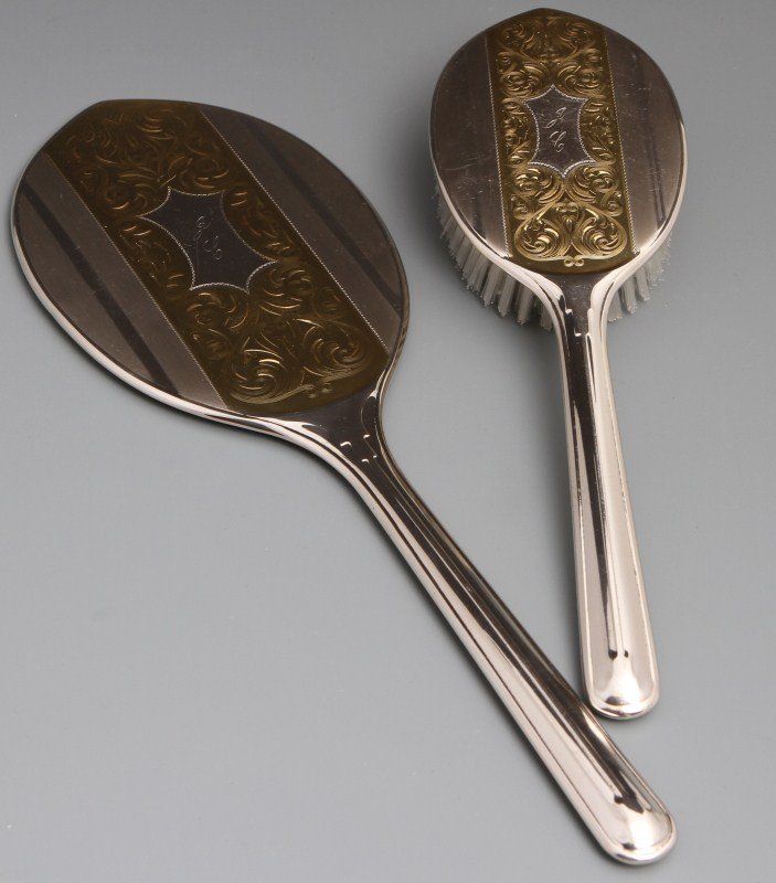 STERLING ELGIN AMERICAN MIRROR AND BRUSH SET: STERLING ELGIN AMERICAN MIRROR AND BRUSH SET Mirror and brush set, with the monogram "JC" on the back of both. Both pieces also have a two tone design on the reverse. Weight 12.24 ozt (with brush and 