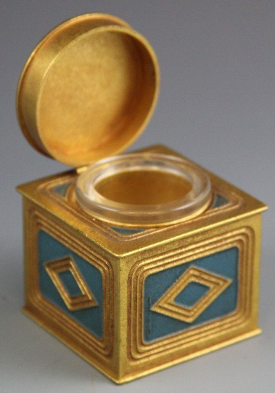 BRONZE TIFFANY STUDIOS INK WELL: BRONZE TIFFANY STUDIOS INK WELL Small inkwell with glass insert bottom marked "Tiffany Studios New York 1813". Blue Diamond design on all sides and top. Size: 2.25"