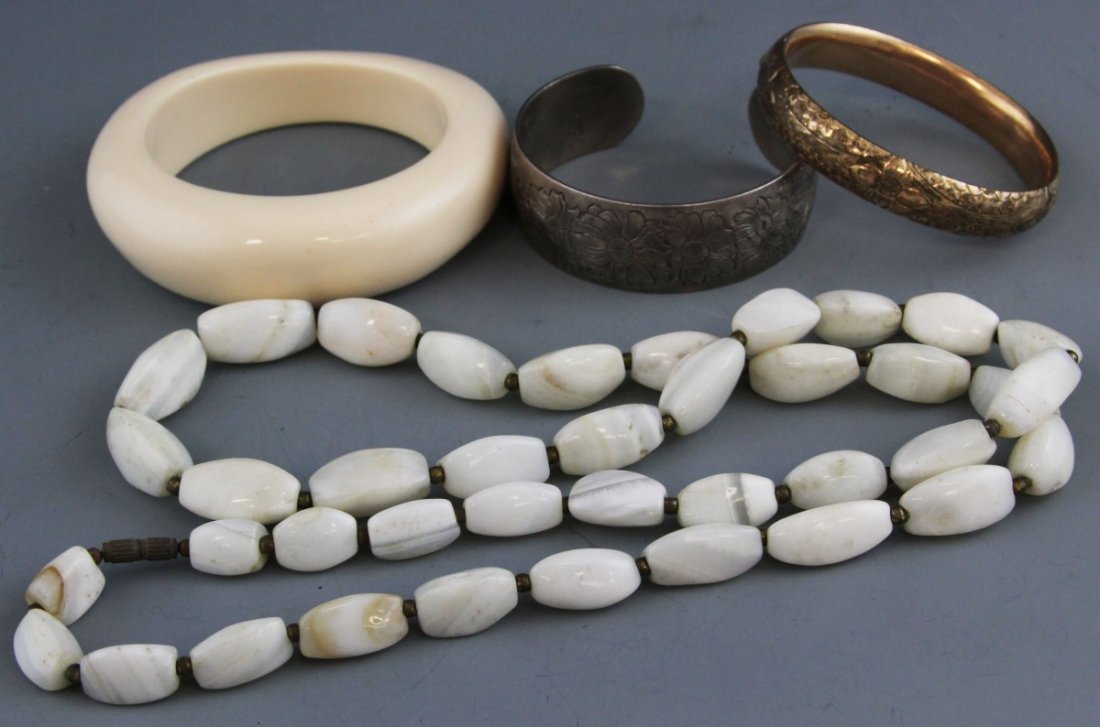 (3) COSTUME BRACELETS & NECKLACE: (3) COSTUME BRACELETS & NECKLACE Lot of costume bracelets including a sterling cuff, an ivory color composite bangle, and a gold-filled bangle. Also includes one white beaded necklace. Weight: 268g