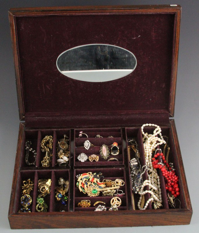 LARGE BOX OF COSTUME JEWELRY: LARGE BOX OF COSTUME JEWELRY A large wooden inlaid jewelry box, lined with red felt, filled with costume jewelry. Included are rings, necklaces, bracelets, earrings and pins. Some with rhinestones. Si