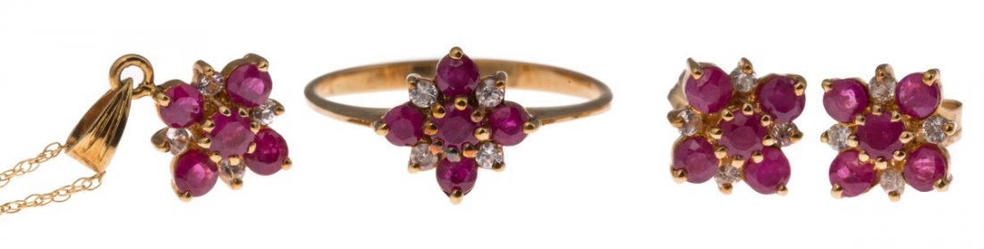 LADIES 10K YELLOW GOLD RUBY JEWELRY SET: LADIES 10K YELLOW GOLD RUBY JEWELRY SET Ladies matching 10K yellow gold jewelry set. Ruby and white zircon ring, post-back stud earrings, and pendant. 1.75 Ctw in rubies, and 0.38 Ctw in white zircon.