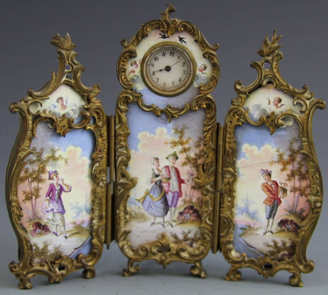LOUIS XV STYLE GILT ENAMELED FOLDING DESK CLOCK: LOUIS XV STYLE GILT ENAMELED FOLDING DESK CLOCK Lady's dressing screen three panel folding desk clock, enamel panels with gilt metal trim, Louix XV style. Weight: 206g Size: 5.5 x 4.5"