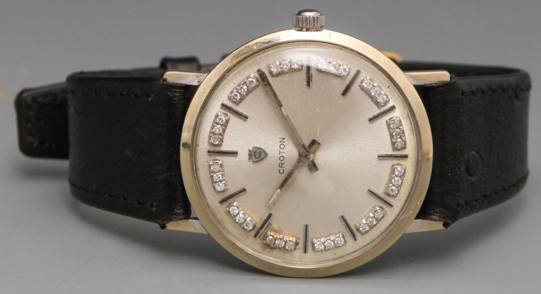 14K CROTON DIAMOND MANUAL WRISTWATCH: 14K CROTON DIAMOND MANUAL WRISTWATCH Croton men's manual wristwatch,14K white gold case no. 21459, silver toned baton numerals with 36 total diamonds in between and silver toned hour and minute hands.