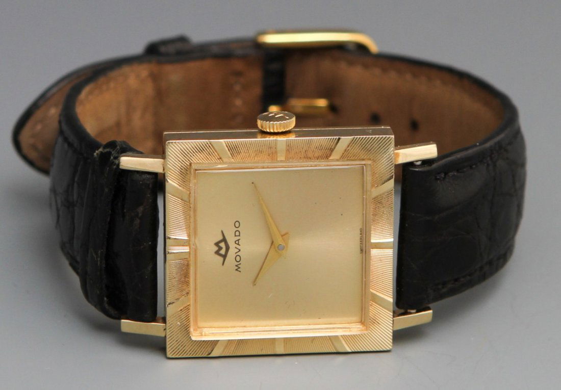 14K MOVADO MANUAL WRISTWATCH: 14K MOVADO MANUAL WRISTWATCH Movado 17 Jewel Manual Wristwatch, 14K gold case #45226, MXI movement; gold toned hour, minute hands with gold face. Black genuine crocodile 17R band with some use. Engrav