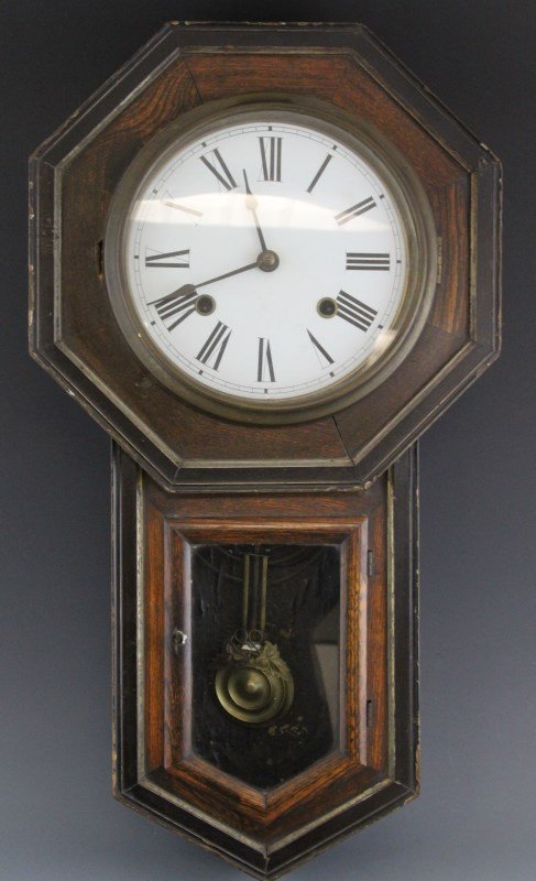 VICTORIAN 8-DAY SCHOOL HOUSE WALL CLOCK: VICTORIAN 8-DAY SCHOOL HOUSE WALL CLOCK Victorian "school house" 8-day regulator wall clock with wood body gilded trim case, circa. late 19th C. Working condition is unknown, does not include key. Siz