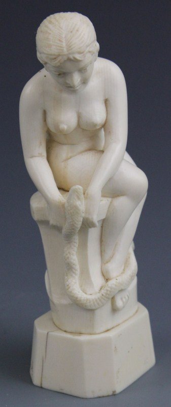 CONTINENTAL IVORY CARVING EVE WITH SNAKE: CONTINENTAL IVORY CARVING EVE WITH SNAKE Continental ivory carving of eve, seated with snake. 114g 4.5"
