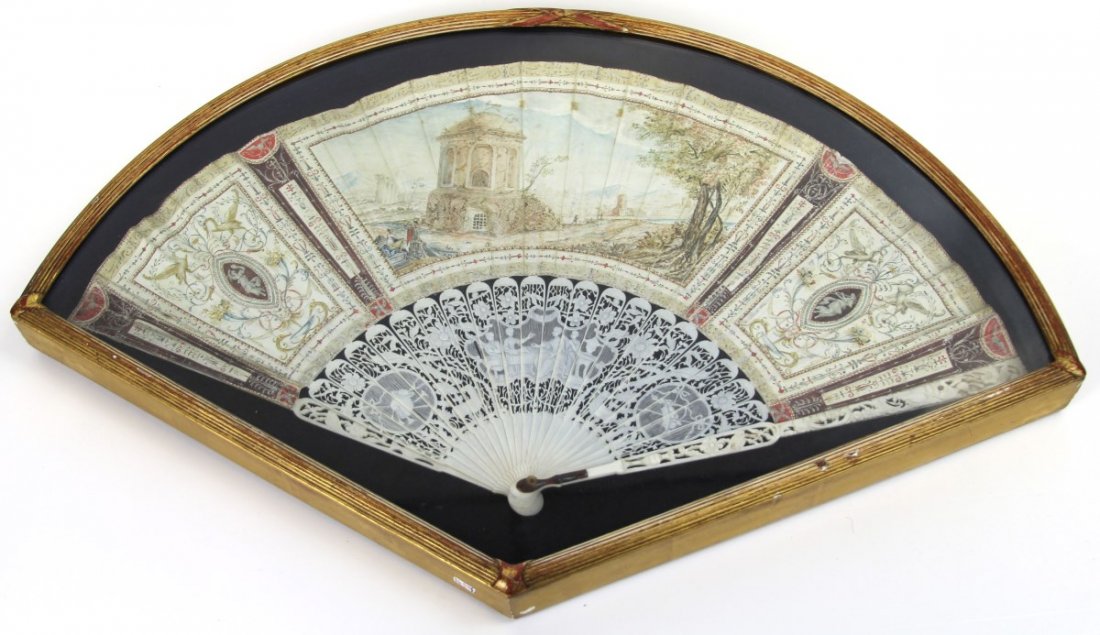 FRAMED FRENCH HAND PAINTED IVORY FAN 19TH CENTURY: FRAMED FRENCH HAND PAINTED IVORY FAN 19TH CENTURY Framed in black shadow box with gilt frame. 19th century French hand painted ivory frame. Size: 22.5 x 14.5 x 1.75"