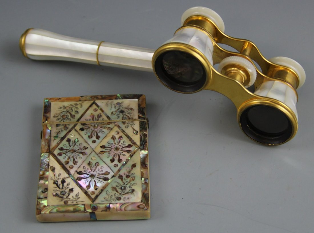 MOTHER OF PEARL OPERA GLASSES & CARD CASE: MOTHER OF PEARL OPERA GLASSES & CARD CASE Circa 1900. Marked Lemaire Fi Paris, with mother of pearl encased lenses and handle. Mosaic MoP card case unmarked with small pieces of MoP missing on top. S