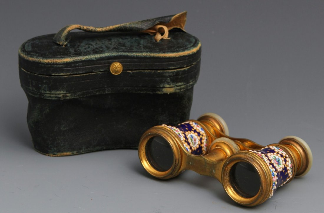 FRENCH ENAMEL OPERA GLASSES WITH CASE: FRENCH ENAMEL OPERA GLASSES WITH CASE A pair of French enameled opera glasses, with mother of pearl lenses, blue floral enamel motif with gilt accents. Size: 3.5" wide