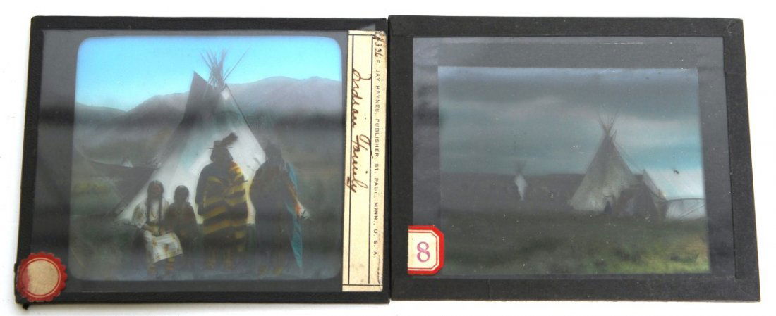 (2) NATIVE AMERICAN GLASS SLIDES: (2) NATIVE AMERICAN GLASS SLIDES Pair of colored magic lantern glass slides, circa early 20th C. Images depict a family of Native Americans, produced by St. Paul, Minn. U.S.A; and a teepee settlement.