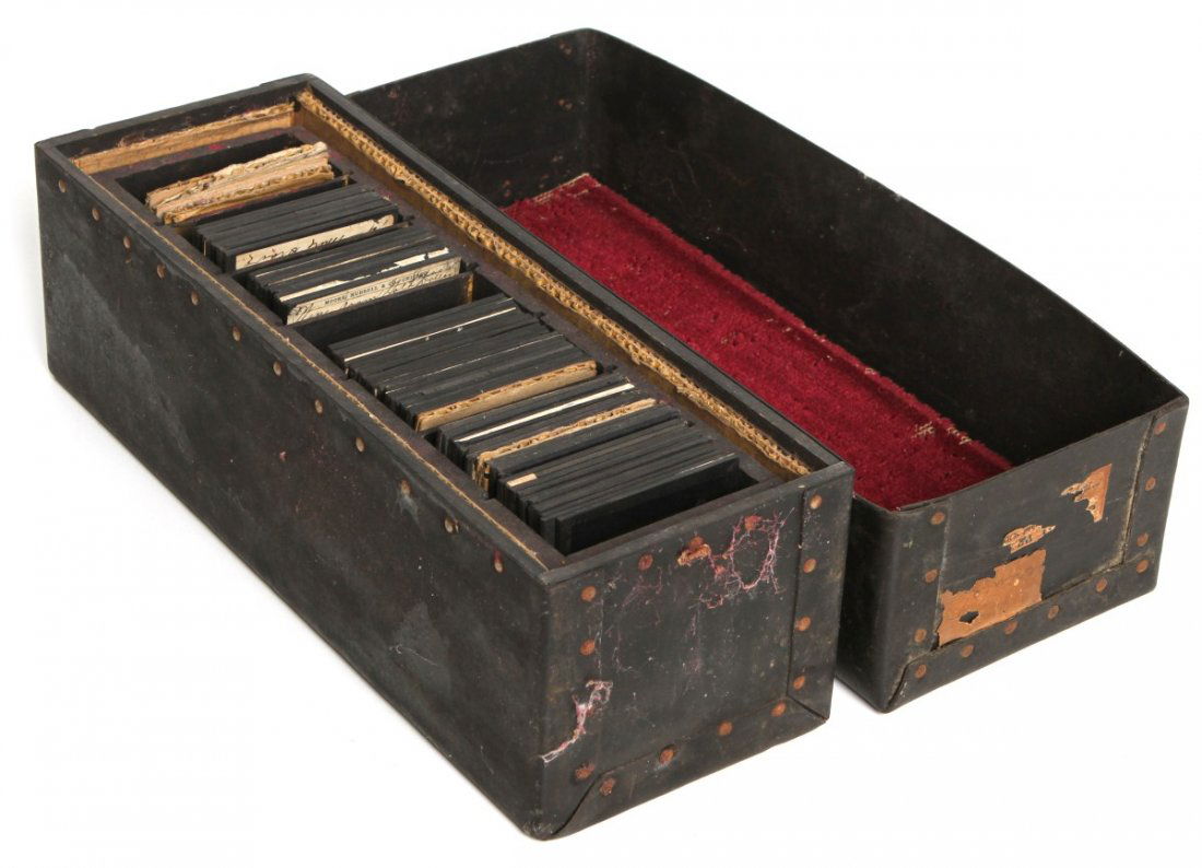 (60) MAGIC LANTERN RESIDENTIAL GLASS SLIDES: (60) MAGIC LANTERN RESIDENTIAL GLASS SLIDES Lot of 60 colored/black & white magic lantern glass slide positives with antique storage box, circa. late 19th/ early 20th C. Slides include personal and co