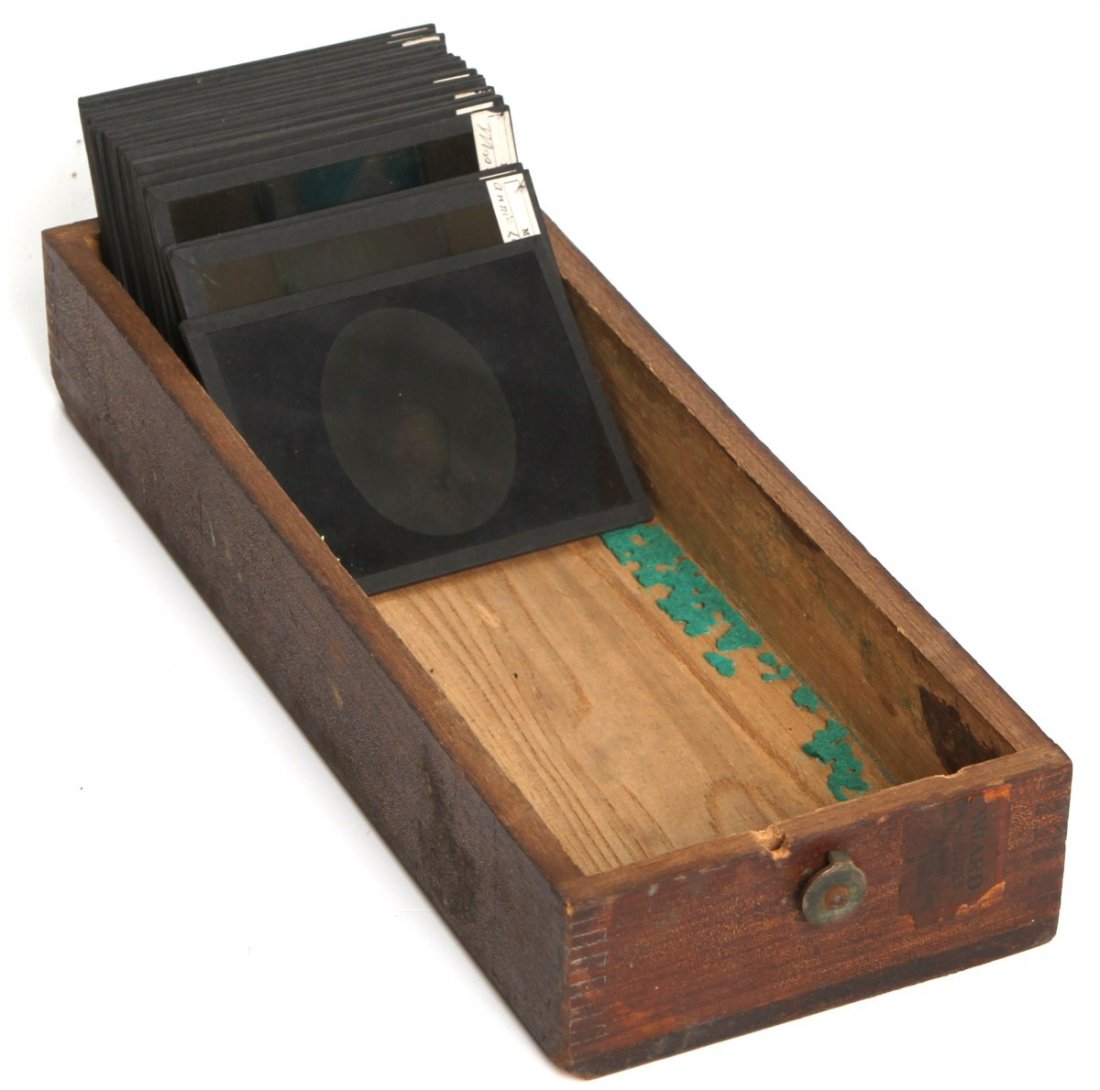 (21) MUMLER SPIRIT PHOTO GLASS SLIDES: (21) MUMLER SPIRIT PHOTO GLASS SLIDES Lot of 21 colored magic lantern glass slides, circa early 20th C. Slide contain images of William H. Mumler's "spirit photography" in this series of manipulated p