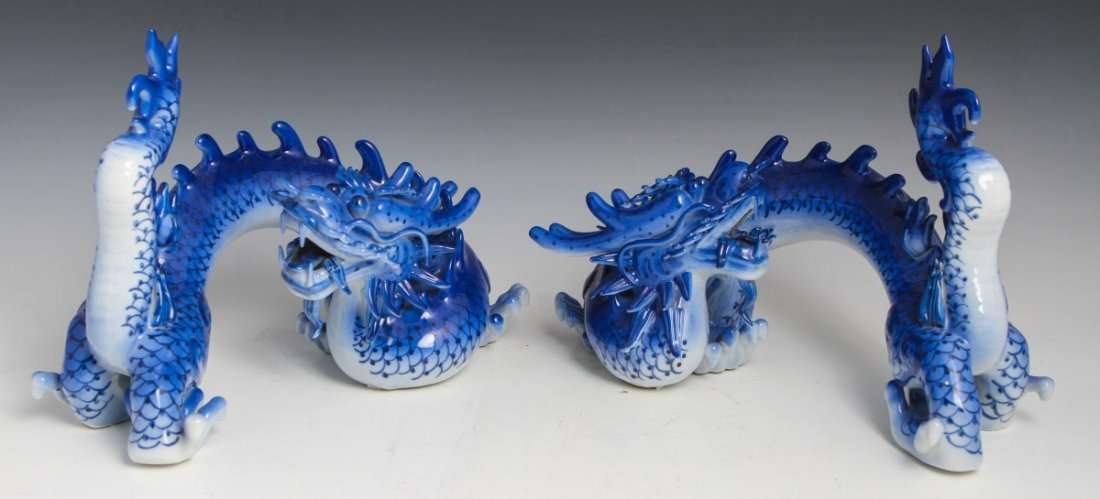 PAIR OF DECORATIVE CERAMIC BLUE AND WHITE DRAGONS
