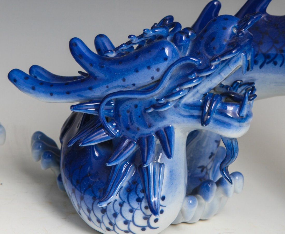 PAIR OF DECORATIVE CERAMIC BLUE AND WHITE DRAGONS - 2