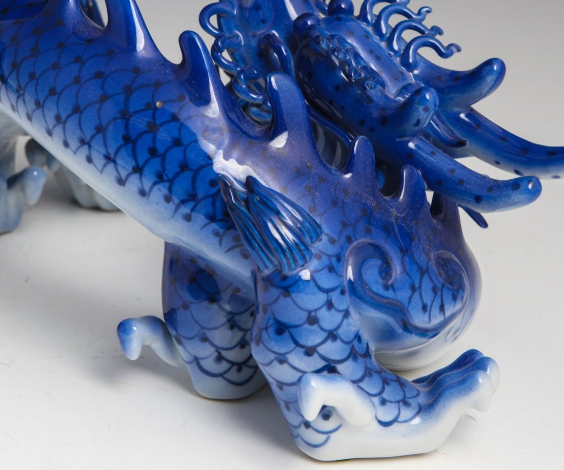 PAIR OF DECORATIVE CERAMIC BLUE AND WHITE DRAGONS - 3