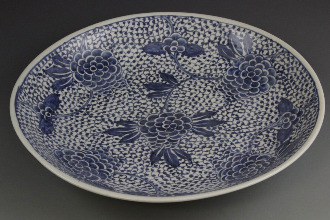 19TH C CHINESE BLUE AND WHITE CHARGER: 19TH C CHINESE BLUE AND WHITE CHARGER Antique Chinese blue and white deep dish charger, floral motif. Painted seal on underside, circa. 19th C. Size: 15"