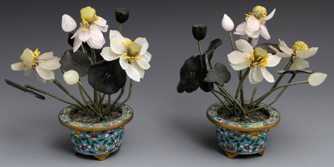 (2) STONE CARVED FLOWERS IN CLOISONNE POTS: (2) STONE CARVED FLOWERS IN CLOISONNE POTS Pair of stone carved lotus blossoms with adjustable wrapped wire stems, set in cloisonne pot. Size: 7"