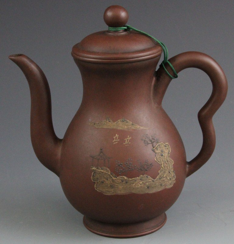 CHINESE YIXING ZISHA TEAPOT CALLIGRAPHY LANDSCAPE: CHINESE YIXING ZISHA TEAPOT CALLIGRAPHY LANDSCAPE Chinese 6.5" Yixing Zisha teapot with calligraphy accents. One side has script, the other features landscape. Stamped on bottom. Size: 6.5" Weight: 29