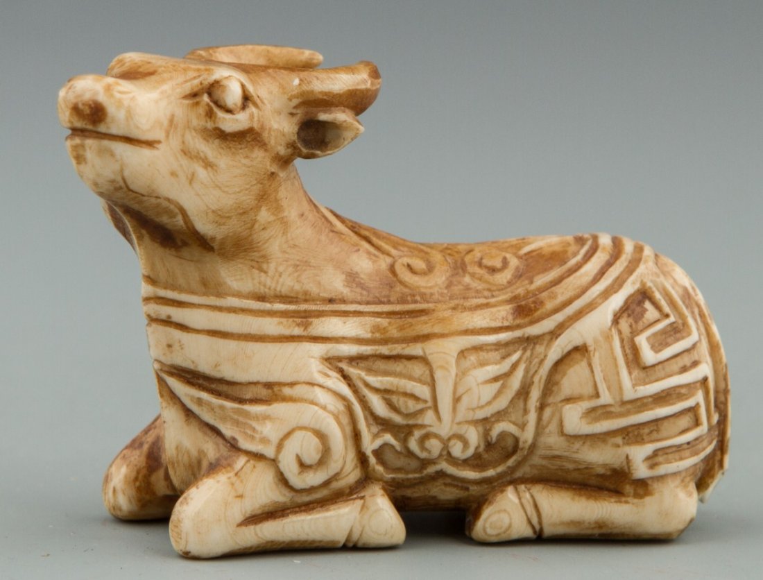 CARVED IVORY OX PENDANT STAINED