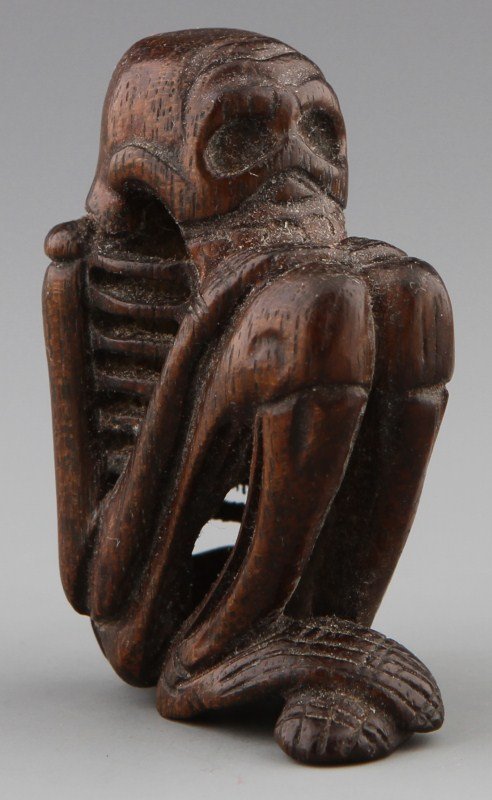 CARVED WOODEN NETSUKE OF A SKELETON
