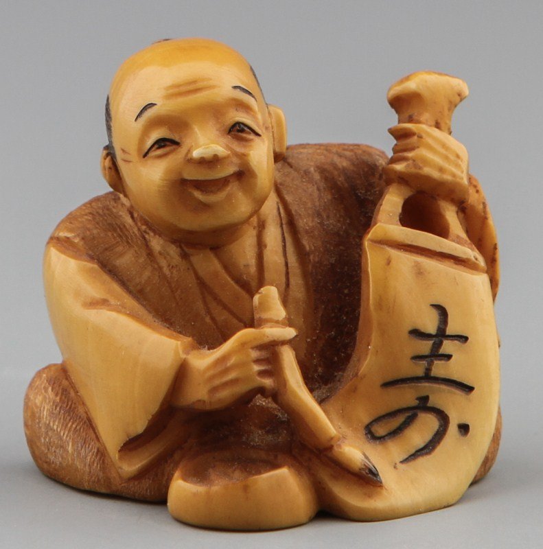 JAPANESE CARVED IVORY NETSUKE SCHOLAR SIGNED