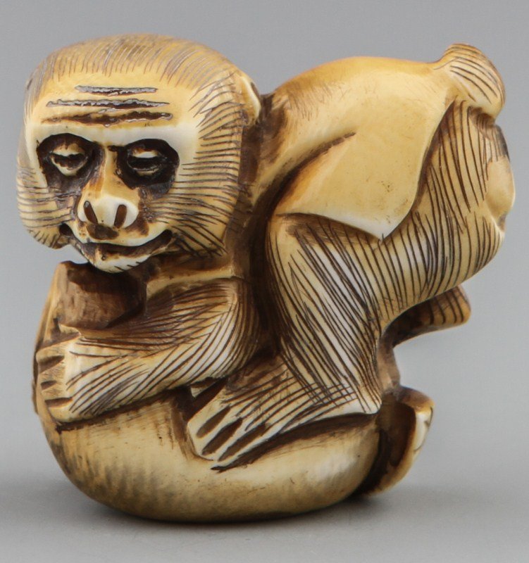JAPANESE CARVED IVORY NETSUKE MONKEY IN CLOTHES