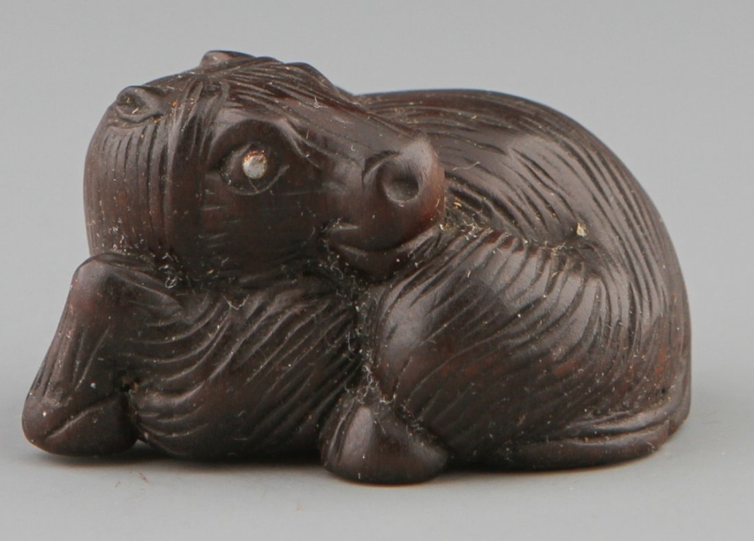 JAPANESE CARVED WOODEN NETSUKE LYING HORSE