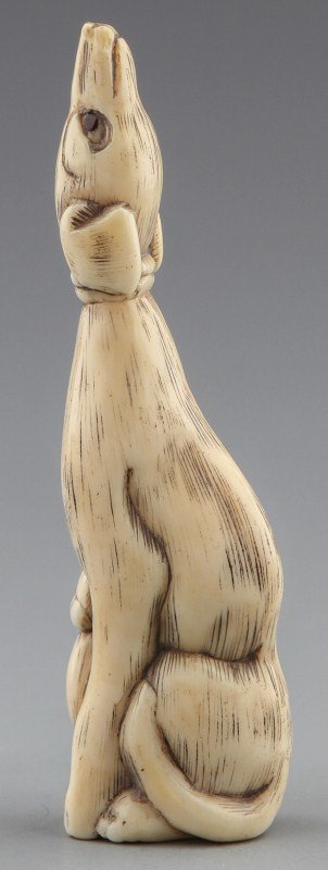 JAPANESE CARVED IVORY SASHI NETSUKE DOG