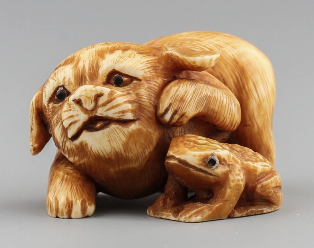 JAPANESE CARVED IVORY NETSUKE FROG AND PUPPY