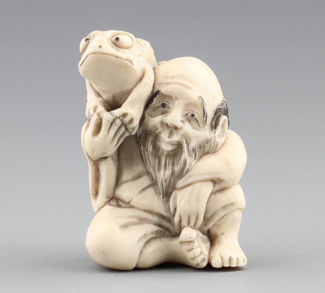 JAPANESE CARVED IVORY NETSUKE ELDER WITH FROG