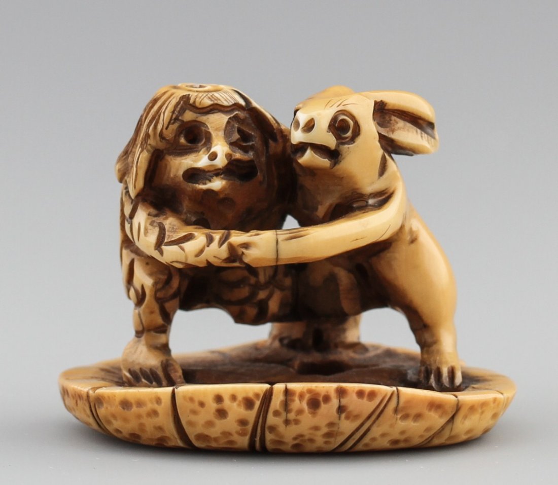 JAPANESE CARVED IVORY NETSUKE KAPPA AND HARE