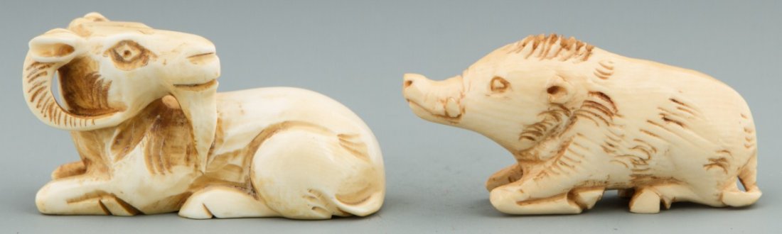 JAPANESE CARVED IVORY NETSUKES RAM AND BOAR: JAPANESE CARVED IVORY NETSUKES RAM AND BOAR Japanese ivory netsuke carved in the form of a ram and a boar. Both figures are recumbent, all four legs folded beneath themselves. Both are etched and tea 