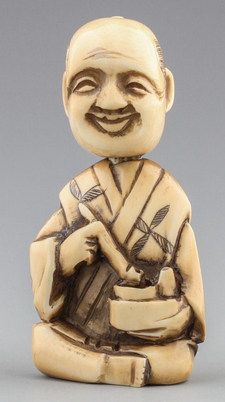 JAPANESE CARVED IVORY NETSUKE CALLIGRAPHER