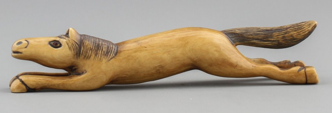 JAPANESE CARVED IVORY NETSUKE RUNNING HORSE BAISHO
