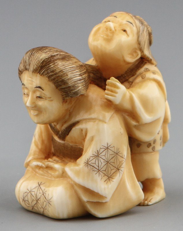JAPANESE CARVED IVORY NETSUKE BLIND MASSAGE: JAPANESE CARVED IVORY NETSUKE BLIND MASSAGE Japanese carved ivory netsuke figure of blind massage. Signed, Tomomasa. Size: 2 x 1 x 1.5" Weight: 25.5g